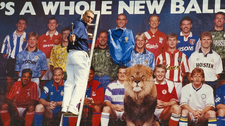 Wimbledon player Vinnie Jones nails a Wimbledon shirt to his image on a billboard promoting the first Premier League season in July 1992 after rejoined the club