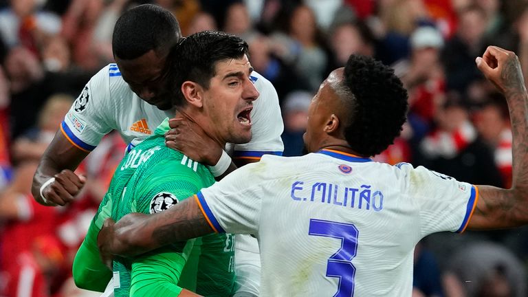 Real Madrid's goalkeeper Thibaut Courtois reacts after a save during the Champions League final soccer match between Liverpool and Real Madrid at the Stade de France in Saint Denis near Paris, Saturday, May 28, 2022. (AP Photo/Petr David Josek)