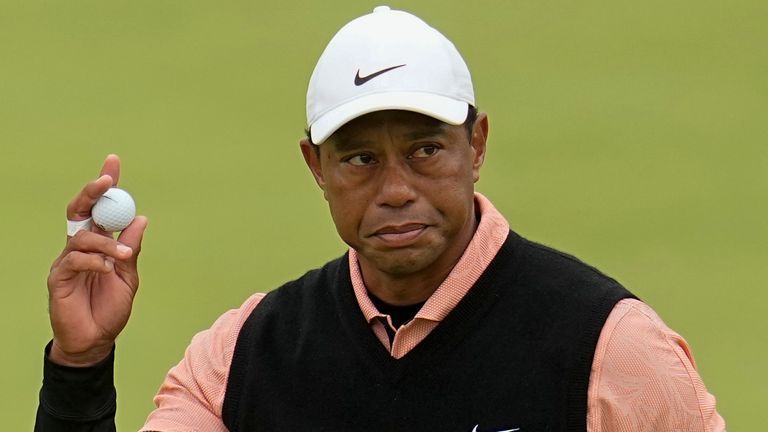 Tiger Woods waves after making a putt on the 18th hole during the third round of the PGA Championship golf tournament at Southern Hills Country Club, Saturday, May 21, 2022, in Tulsa, Okla.  (AP Photo/Sue Ogrocki)