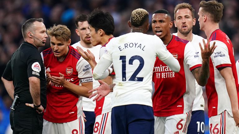 Arsenal and Tottenham players come together after Rob Holding was shown a red card