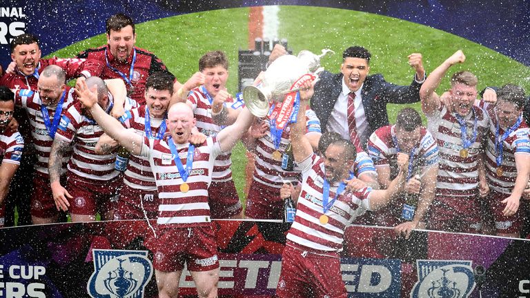 Wigan Warriors lift the Challenge Cup after beating Huddersfield Giants in the final