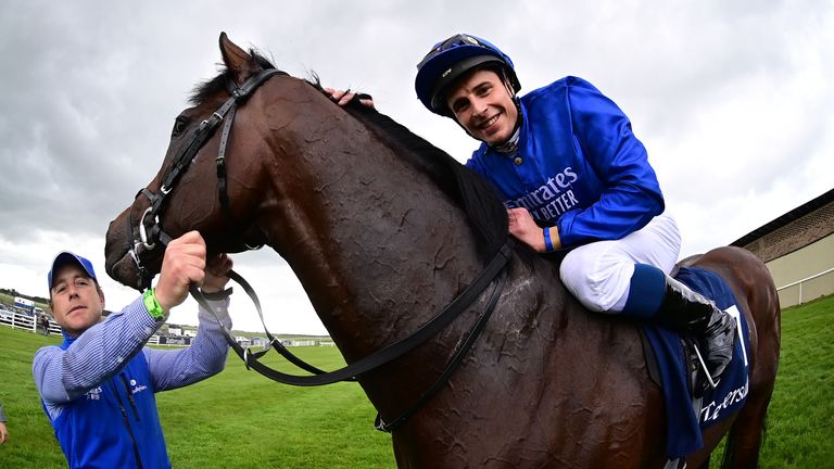 William Buick smiles for the cameras after winning the Irish 2000 Guineas