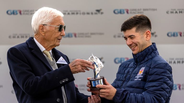 Lester Piggott (left) presents the apprentice championship trophy to Marco Ghiani