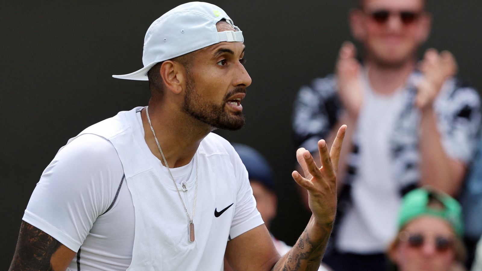 Nick Kyrgios admits spitting in direction of abusive fan during Wimbledon first-round win and questions ‘old man’ line judge