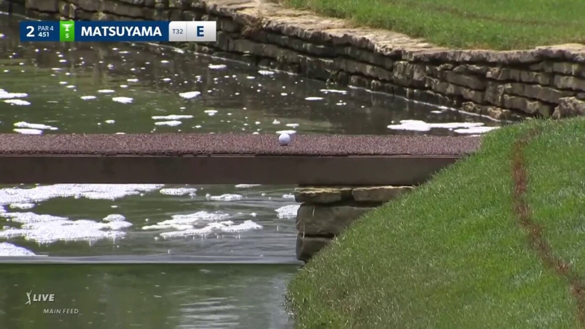 Saved by the bridge! Matsuyama incredibly avoids water but fluffs next shot