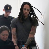 WNBA star and two-time Olympic gold medalist Brittney Griner is escorted to a courtroom for a hearing in Russia
