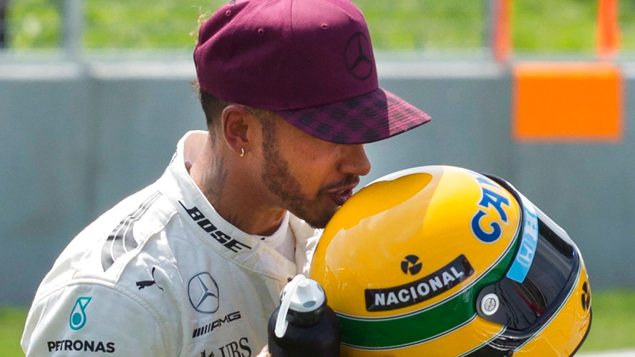 F1 fans ask 'is he single' as Lewis Hamilton rocks up at Brazilian