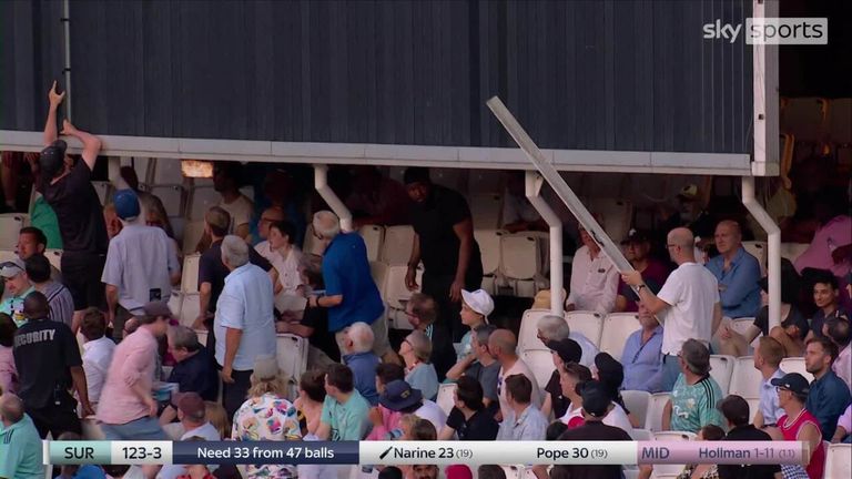 Sunil Narine smashes a six so hard it damaged the sightscreen! Fans in the crowd looked to lend a helping hand to fix it