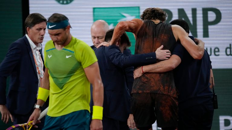 Germany&#39;s Alexander Zverev is carried off the court after twisting his ankle during the semifinal match against Spain&#39;s Rafael Nadal, left, at the French Open tennis tournament in Roland Garros stadium in Paris, France, Friday, June 3, 2022.