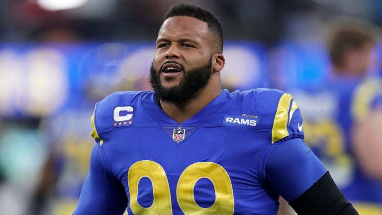 Los Angeles Rams' Aaron Donald warms up before an NFL wild-card playoff football game against the Arizona Cardinals in Inglewood, Calif., Jan. 17, 2022. All-Pro defensive tackle Donald is getting a big raise to stay with the Rams under a reworked contract through 2024. The Super Bowl champion Rams announced Donald's return Monday, June 6, 2022. (AP Photo/Jae C. Hong, File)