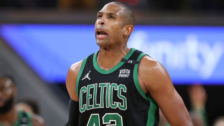 Boston Celtics center Al Horford (42) reacts after scoring against the Golden State Warriors during the second half of Game 5 of basketball's NBA Finals in San Francisco, Monday, June 13, 2022. (AP Photo/Jed Jacobsohn)