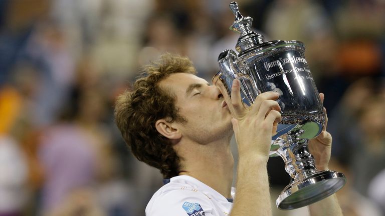 Britain's Andy Murray poses with the trophy after beating Serbia's Novak Djokovic in the championship match at the 2012 US Open tennis tournament in New York. Britain's first male champion at Wimbledon in 77 years will attempt to defend a Grand Slam title for the first time in his career, at the U.S. Open. (AP Photo/Darron Cummings, File)