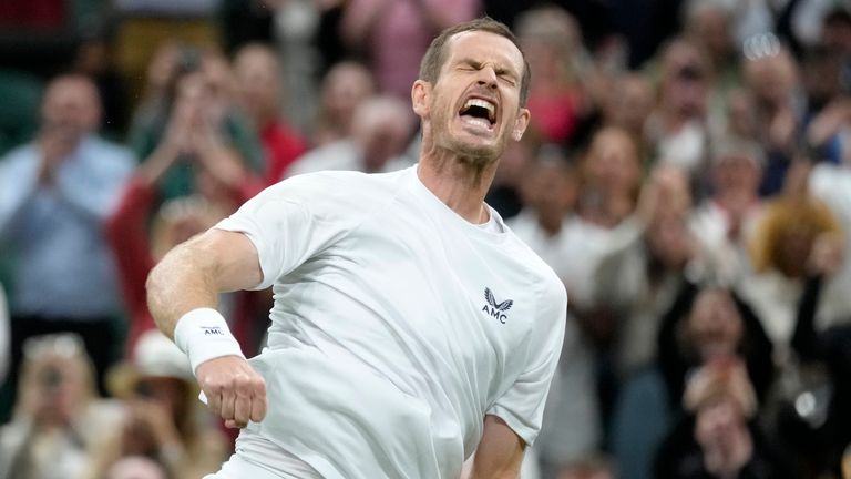 Britain's Andy Murray celebrates after beating Australia's James Duckworth in a first round men's singles match on day one of the Wimbledon tennis championships in London, Monday, June 27, 2022. (AP Photo/Kirsty Wigglesworth)