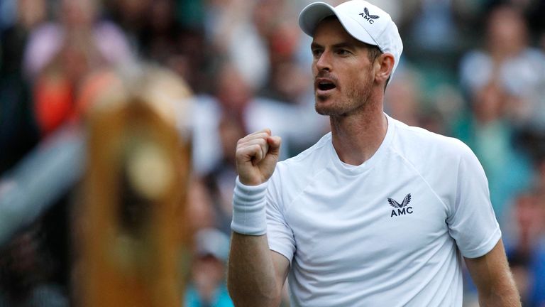 Britain's Andy Murray reacts during his men's singles tennis match against Australia's James Duckworth on the first day of the 2022 Wimbledon Championships at The All England Tennis Club in Wimbledon, southwest London, on June 27, 2022. - RESTRICTED TO EDITORIAL USE (Photo by Adrian DENNIS / AFP) / RESTRICTED TO EDITORIAL USE (Photo by ADRIAN DENNIS/AFP via Getty Images)