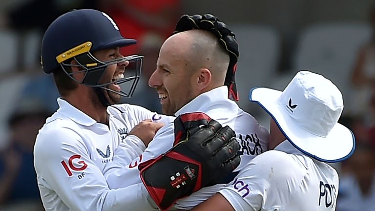 England's Jack Leach, center, celebrates with teammates the dismissal of New Zealand's Henry Nicholls during the first day of the third cricket test match between England and New Zealand at Headingley in Leeds, England, Thursday, June 23, 2022. (AP Photo/Rui Vieira)