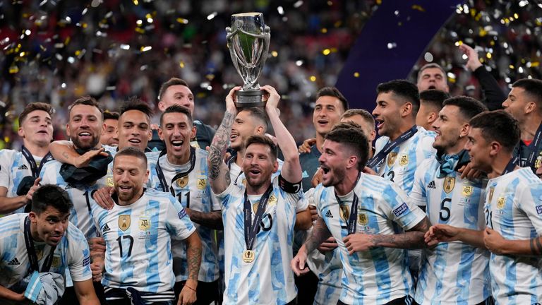 Argentina&#39;s Lionel Messi holds a trophy as he celebrates with his teammates after winning the Finalissima soccer match between Italy and Argentina at Wembley Stadium in London , Wednesday, June 1, 2022. Argentina won 3-0.