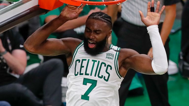 Boston Celtics guard Jaylen Brown reacts after dunking the ball during Game 3