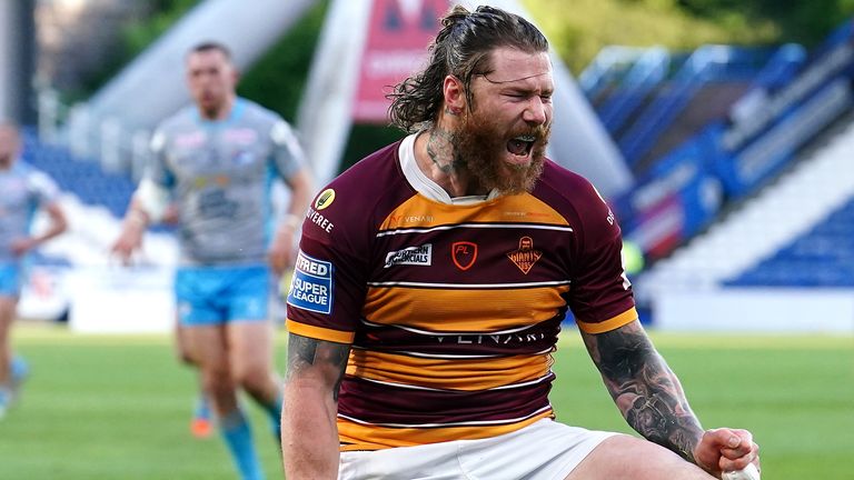 Chris McQueen celebrates after scoring Huddersfield's fourth try against Leeds