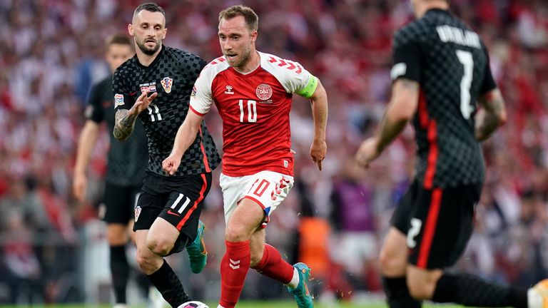 Denmark&#39;s Christian Eriksen, center, and Croatia&#39;s Marcelo Brozovic, left, fight for the ball during the UEFA Nations League soccer match between Denmark and Croatia in Parken Stadium in Copenhagen, Denmark, Friday, June 10, 2022. (Liselotte Sabroe/Ritzau Scanpix via AP)