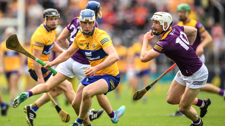 18 June 2022; Diarmuid Ryan of Clare is tackled by Ois..n Foley of Wexford during the GAA Hurling All-Ireland Senior Championship Quarter-Final match between Clare and Wexford at the FBD Semple Stadium in Thurles, Tipperary. Photo by Ray McManus/Sportsfile