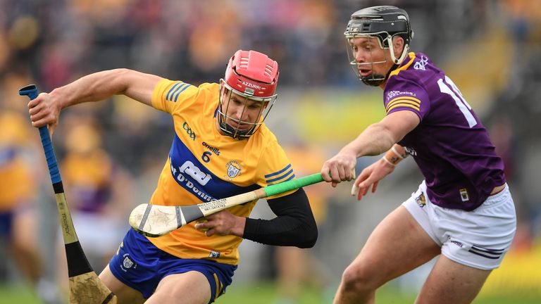 18 June 2022; John Conlon of Clare is tackled by Conor McDonald of Wexford during the GAA Hurling All-Ireland Senior Championship Quarter-Final match between Clare and Wexford at the FBD Semple Stadium in Thurles, Tipperary. Photo by Ray McManus/Sportsfile