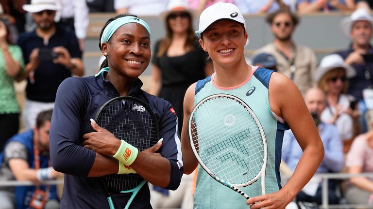 Coco Gauff of the U.S., left, and Poland's Iga Swiatek pose at the net prior to their final match at the French Open tennis tournament in Roland Garros stadium in Paris, France, Saturday, June 4, 2022. (AP Photo/Michel Euler)