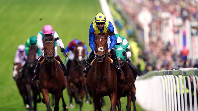 Westover (pink cap) chases home Derby winner Desert Crown at Epsom