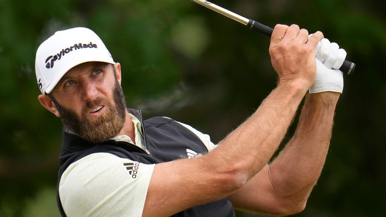 Dustin Johnson watches his shot on the sixth hole during the third round of the U.S. Open golf tournament at The Country Club, Saturday, June 18, 2022, in Brookline, Mass. (AP Photo/Julio Cortez)