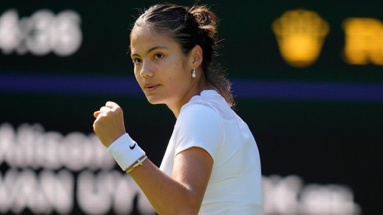 Britain's Emma Raducanu reacts after wining a point against Belgium's Alison van Uytvanck in a women's first round singles match on day one of the Wimbledon tennis championships in London, Monday, June 27, 2022. (AP Photo/Kirsty Wigglesworth)