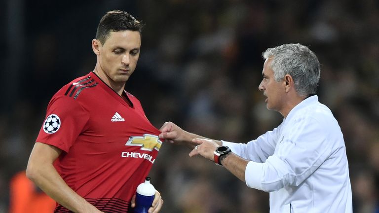 Manchester United's Portuguese manager Jose Mourinho (R) gestures as he speaks with Manchester United's Serbian midfielder Nemanja Matic during the UEFA Champions League group H football match between Young Boys and Manchester United at The Stade de Suisse in Bern on September 19, 2018. 