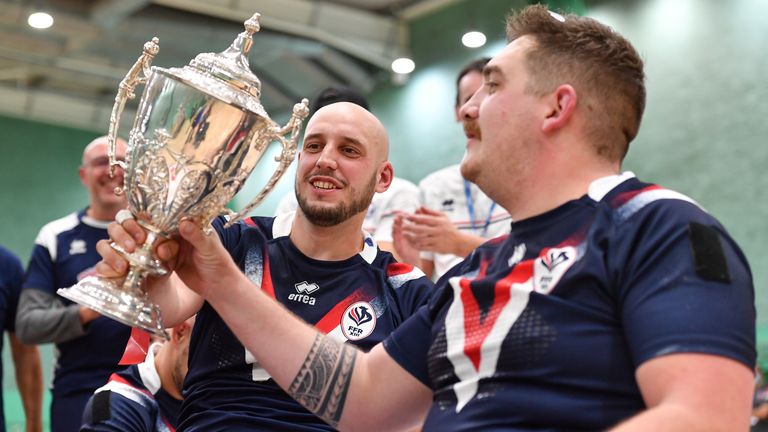 Picture by Will Palmer/SWpix.com - 13/11/2021 - Rugby League - Wheelchair International - England v France - Medway Park Sports Centre, Gillingham, England - J..r..my Bourson of France passes the Fassolette Kielty Trophy to teammate Thomas Duhalde after beating England
