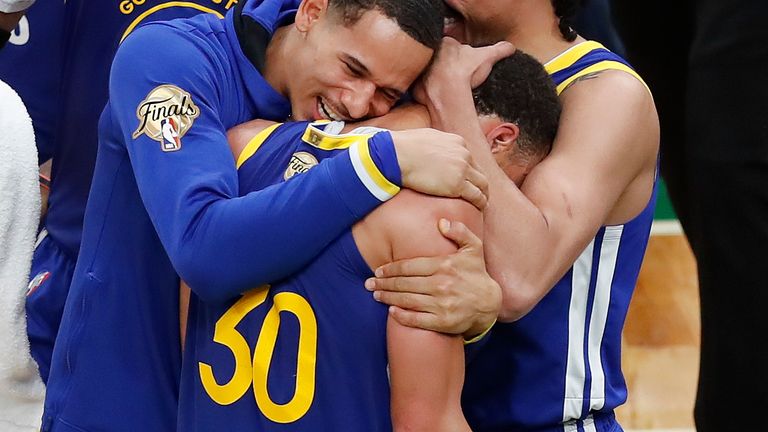 Golden State Warriors guard Stephen Curry (30) celebrates with team-mates after beating the Boston Celtics in Game 6 to win basketball's NBA Finals, Thursday, June 16, 2022, in Boston. (AP Photo/Michael Dwyer)