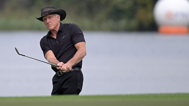 Greg Norman, of Australia, watches after hitting from a bunker onto the 18th green during the final round of the PNC Championship golf tournament Dec. 20, 2020, in Orlando, Fla. Norman says Trump National Doral Miami will host the final event of his Saudi-backed golf series. (AP Photo/Phelan M. Ebenhack, File)