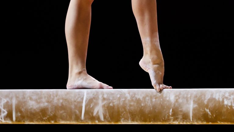 Detail of a competitor on the balance beam