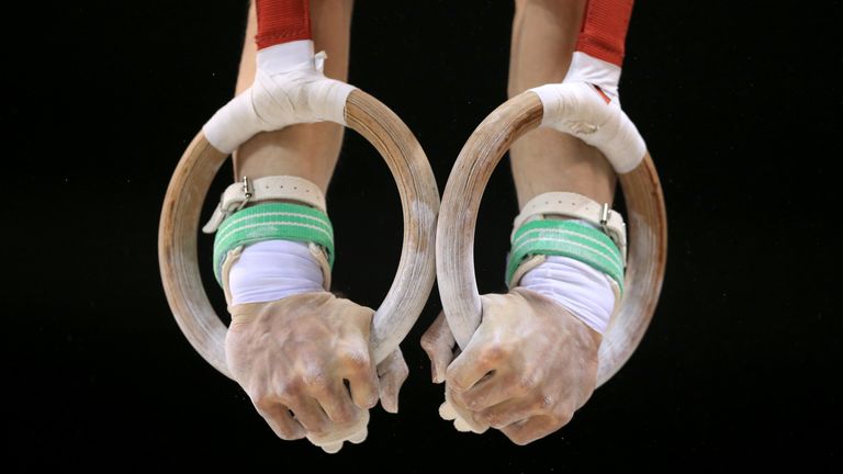 Detail of a competitor on the rings