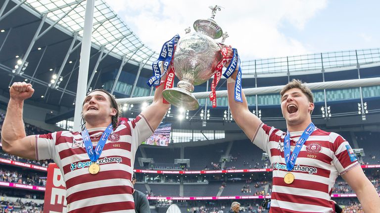 Picture by Allan McKenzie/SWpix.com - 28/05/2022 - Rugby League - Betfred Challenge Cup Final - Huddersfield Giants v Wigan Warriors - Tottenham Hotspur Stadium, London, England - Liam Byrne & Ethan Havard celebrate with the Challenge Cup trophy.