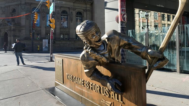 A statue depicting a female hockey player sits across from the Hockey Hall of Fame in Toronto, Friday, Nov. 12, 2021. THE CANADIAN PRESS/Nathan Denette                                                                           