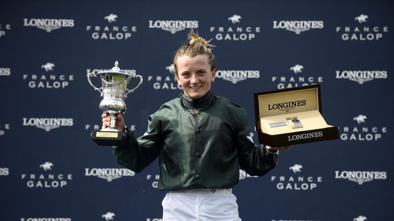 Hollie Doyle receives her trophy and winning prize after Nashwa's success in the Prix de Diane