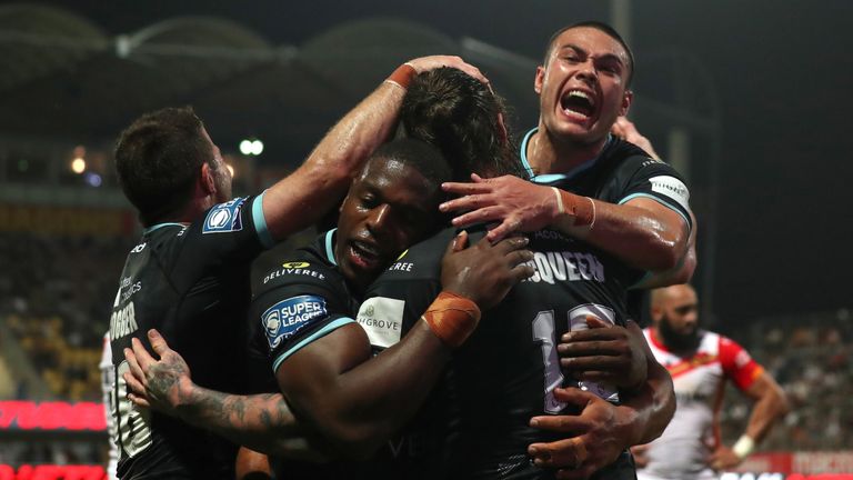 Picture by Manuel Blondeau/SWpix.com - 03/06/2022 - Rugby League - Betfred Super League Round 14 - Catalans Dragons v Huddersfield Giants - Stade Gilbert Brutus, Perpignan, France - Chris McQueen of Huddersfield Giants celebrates with his teammates after scoring a try