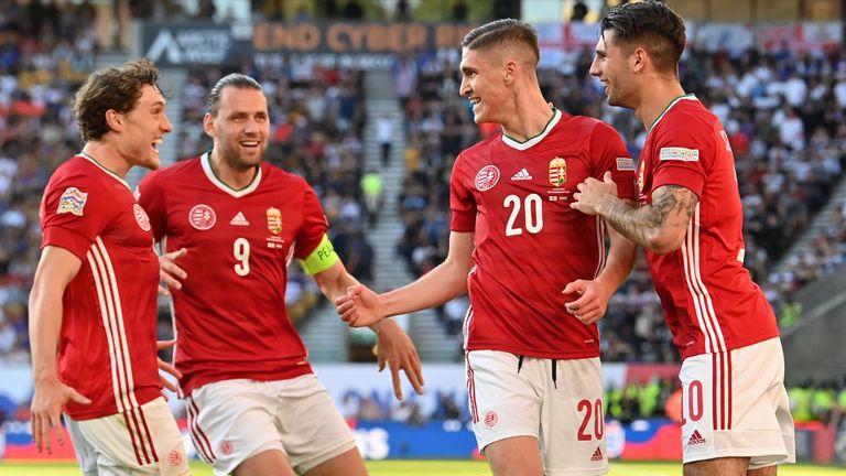 Hungary&#39;s Roland Salai (No 20) celebrates with teammates after scoring the opening goal against England