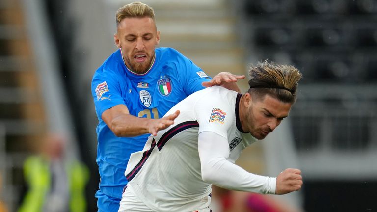 Italy's Davide Frattesi (left) and England's Jack Grealish fight for the ball