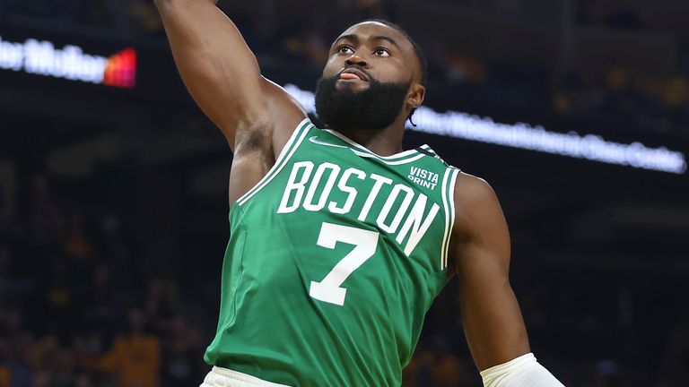 Boston Celtics guard Jaylen Brown dunks against the Golden State Warriors during the first half of Game 1 