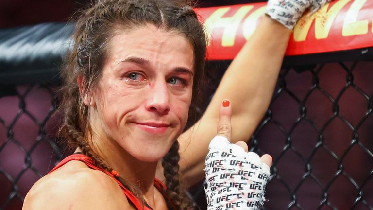 Joanna Jedrzejcyk of Poland reacts to losing to Zhang Weili of China during their Women's Strawweight Fight at Singapore Indoor Stadium on June 12, 2022 in Singapore. 