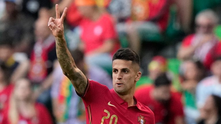 Portugal&#39;s Joao Cancelo celebrates after scoring his side&#39;s first goal during the UEFA Nations League soccer match between Portugal and the Czech Republic, at the Jose Alvalade Stadium in Lisbon, Thursday, June 9, 2022. (AP Photo/Armando Franca)