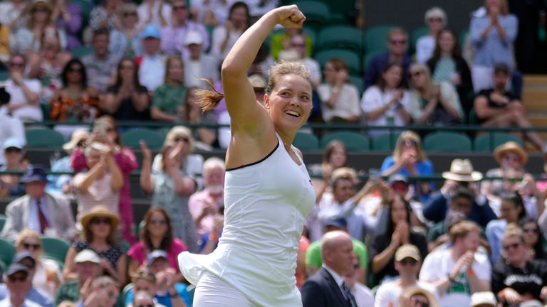 Germany&#39;s Jule Niemeier celebrates defeating Estonia&#39;s Anett Kontaveit during their singles tennis match on day three of the Wimbledon tennis championships in London, Wednesday, June 29, 2022. (AP Photo/Kirsty Wigglesworth)