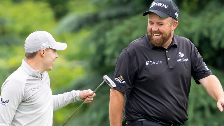 Matt Fitzpatrick, left, of England and Shane Lowry of Ireland share a laugh during the first round of the Canadian Open in Toronto on Thursday, June 9, 2022. (Frank Gunn/The Canadian Press via AP) 