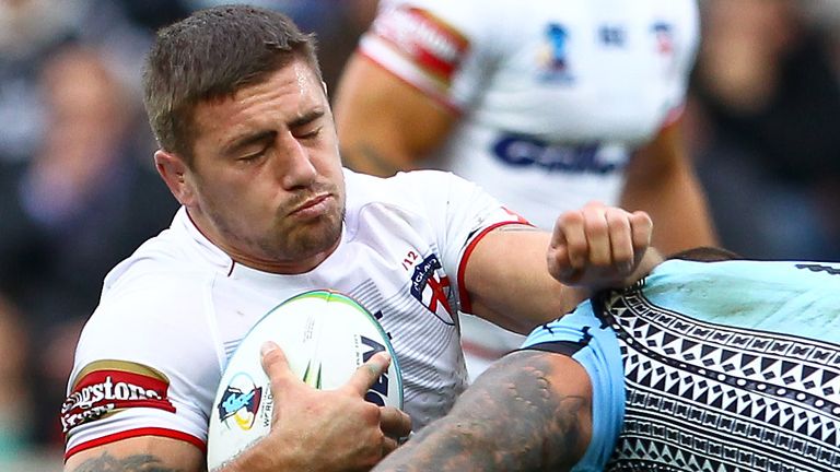 Picture by Alex Whitehead/SWpix.com - 09/11/2013 - Rugby League - Rugby League World Cup - England v Fiji - KC Stadium, Hull, England - England's Michael McIlorum is tackled by Fiji's Tariq Sims.