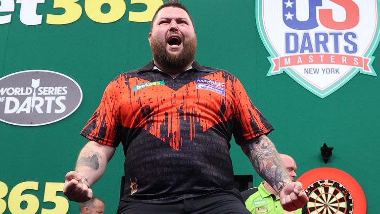 June 4, 2022; New York, NY, USA; Michael Smith celebrates his win over Michael Van Gerwen in the finals of the US Darts Masters at the Hulu Theater.  Mandatory Credit: Ed Mulholland/PDC               