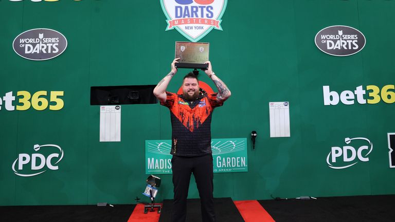 June 4, 2022; New York, NY, USA; Michael Smith celebrates his win over Michael Van Gerwen in the finals of the US Darts Masters at the Hulu Theater.  Mandatory Credit: Ed Mulholland/PDC               