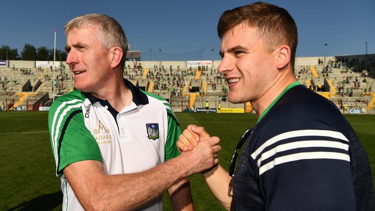 John Kiely celebrates with Casey after the 2021 Munster final
